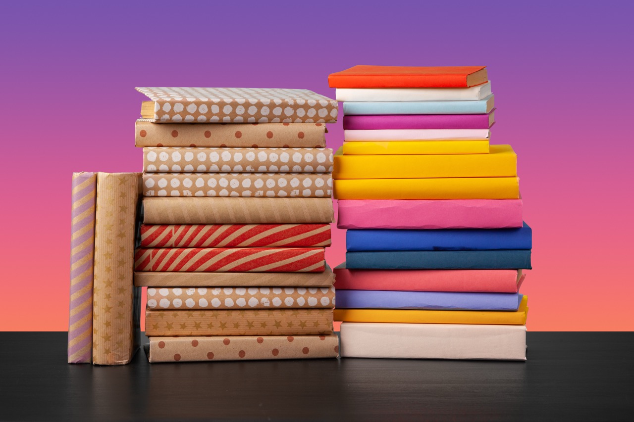 Overwhelming stack of textbooks and study materials